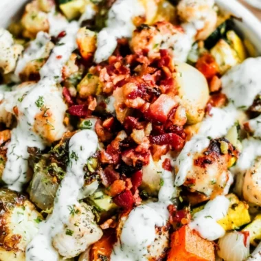 Delicious Chicken Bacon Ranch salad topped with crispy bacon and fresh ingredients.
