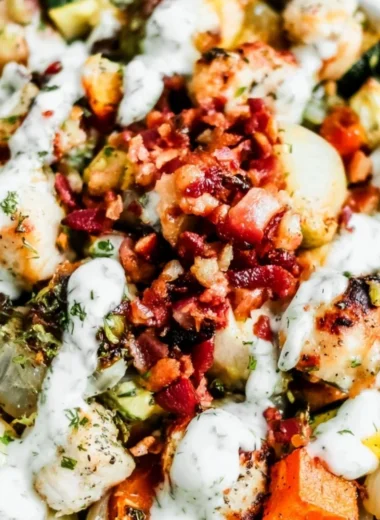 Delicious Chicken Bacon Ranch salad topped with crispy bacon and fresh ingredients.