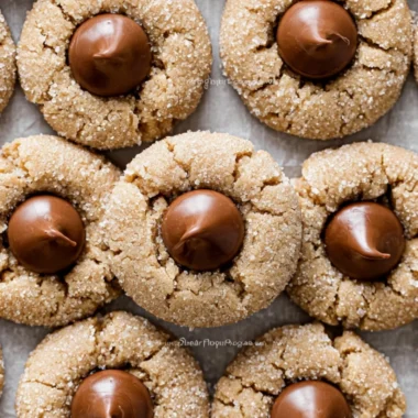 Delicious Peanut Butter Blossoms cookies topped with chocolate kisses