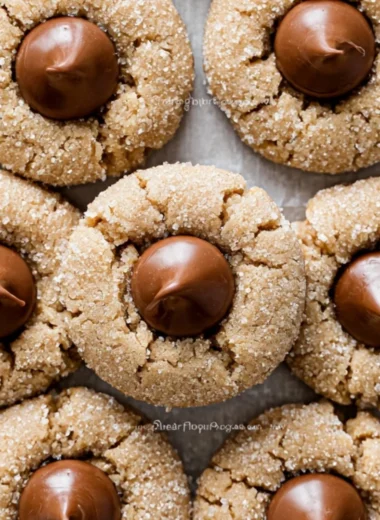Delicious Peanut Butter Blossoms cookies topped with chocolate kisses