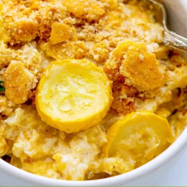 Classic Squash Casserole dish with cheesy topping and fresh squash