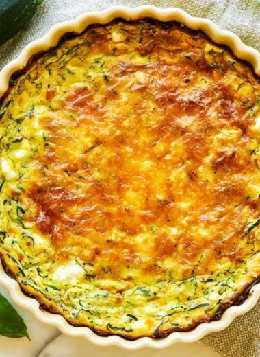 Cottage Cheese Zucchini Quiche served on a plate garnished with herbs