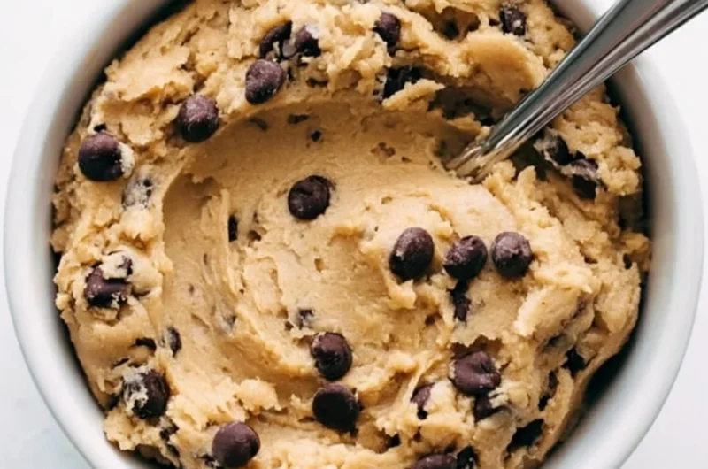 Delicious cozy edible cookie dough in a bowl, evoking sweet nostalgia.