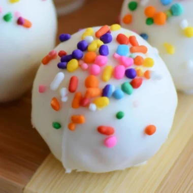 Delicious no-bake cake batter truffles topped with colorful sprinkles