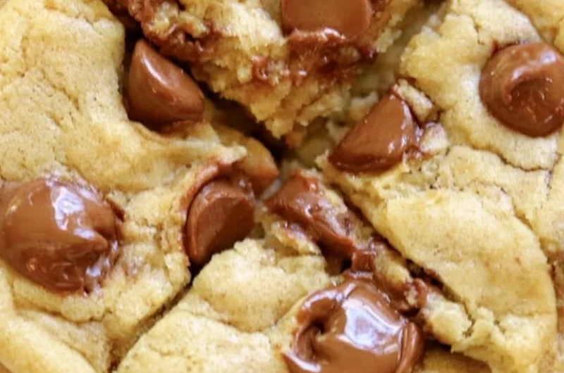 Crumbl chocolate chip cookies with melted chocolate chunks on a plate