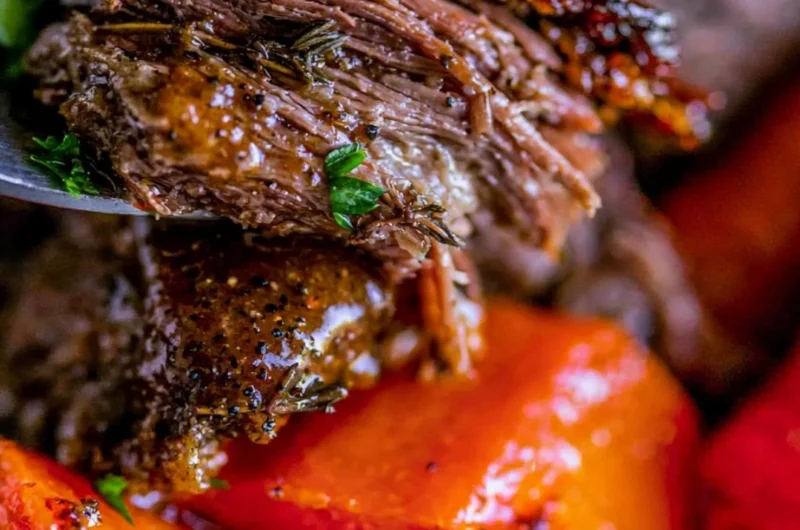 Delicious easy slow cooker pot roast with vegetables in a serving dish.