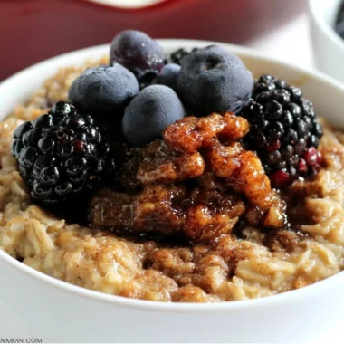 Delicious Maple & Brown Sugar Baked Oatmeal served in a bowl with fresh fruit.