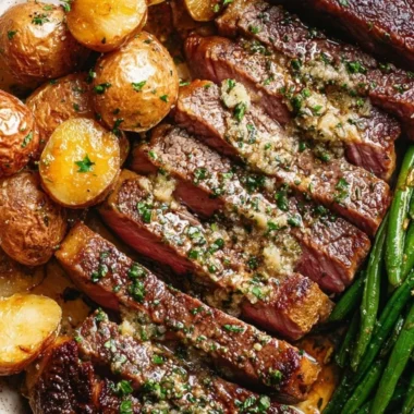 Delicious oven roasted rib-eye steak served with herbs and spices