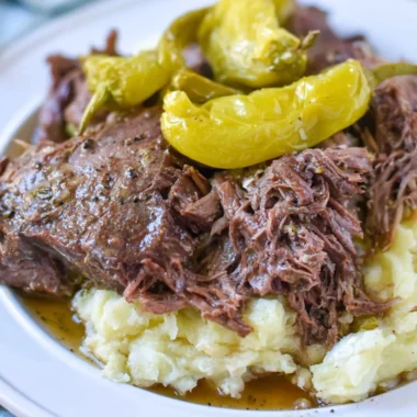 Delicious Whole30 Mississippi Pot Roast served with fresh vegetables