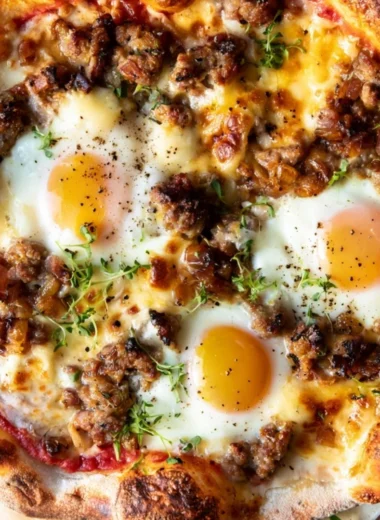 Delicious sausage breakfast pizza served for morning meals
