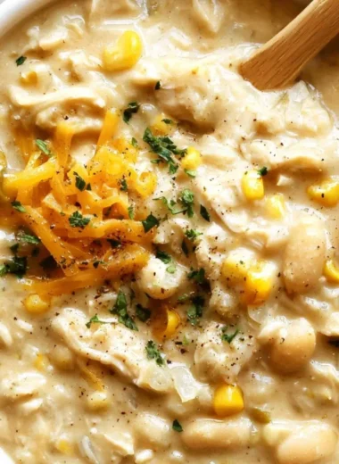Delicious bowl of white chicken chili topped with cilantro and lime