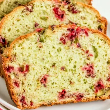 Loaf of cozy cranberry pistachio bread with nuts and cranberries