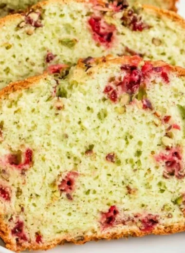 Loaf of cozy cranberry pistachio bread with nuts and cranberries