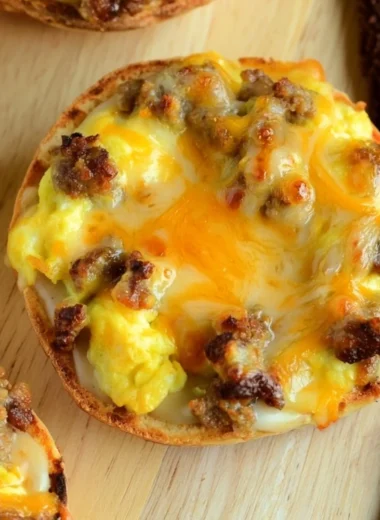 Cozy English muffin breakfast pizza topped with eggs and cheese