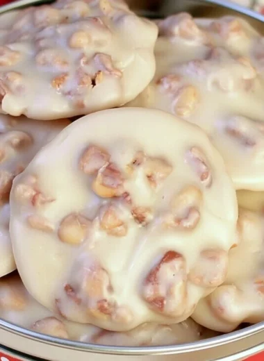 Cozy vanilla pecan pralines on a rustic wooden table, showcasing their delicious texture.