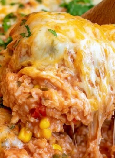 Easy One Pot Cheesy Enchilada Rice dish garnished with fresh herbs