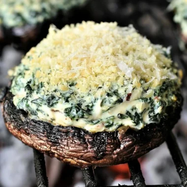 Grilled Spinach Dip-Stuffed Portabella Mushroom Caps garnished and ready to serve