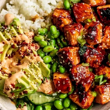 Honey Sriracha Salmon Bowls with fresh vegetables and rice