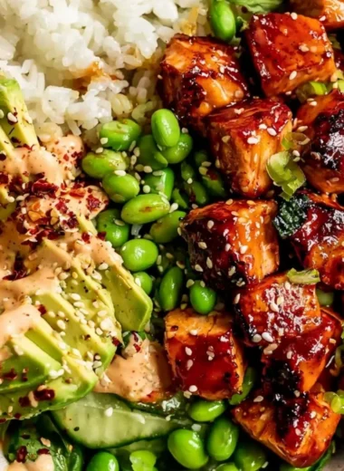 Honey Sriracha Salmon Bowls with fresh vegetables and rice