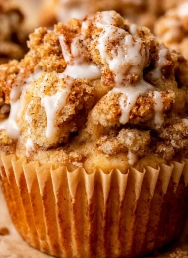 Delicious apple crumble muffins with a crunchy topping fresh out of the oven