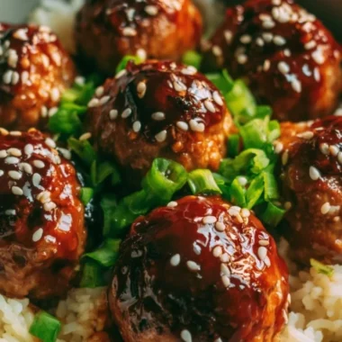 Delicious Asian Meatballs served with sauce and green onions.
