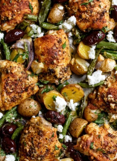 Cozy one-pan Mediterranean chicken with colorful vegetables and herbs.