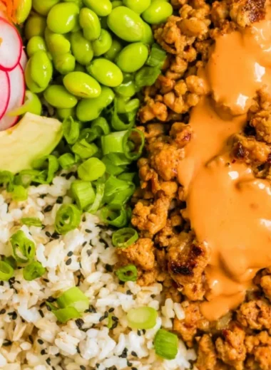 Delicious Bang Bang Ground Turkey Rice Bowls garnished with fresh vegetables