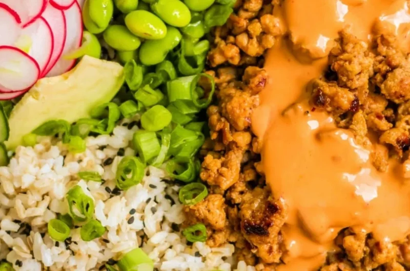 Delicious Bang Bang Ground Turkey Rice Bowls garnished with fresh vegetables