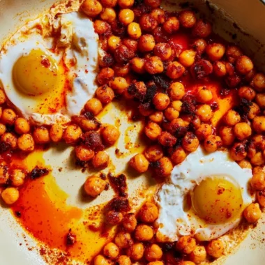 Chickpea fried eggs plated with greens and spices for a nutritious meal