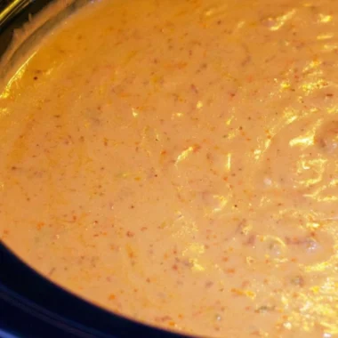 Delicious chorizo cheese dip served in a crockpot, perfect for appetizers.
