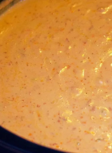 Delicious chorizo cheese dip served in a crockpot, perfect for appetizers.