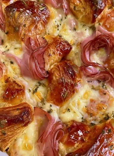 Delicious croissant bake breakfast casserole ready to serve on a dinner table