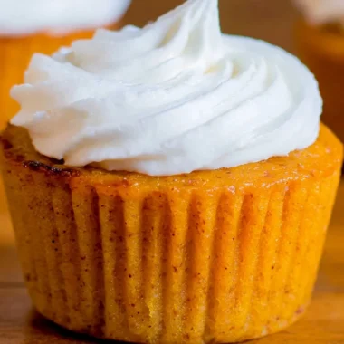 Delicious Impossible Pumpkin Pie Cupcakes topped with cream cheese frosting.