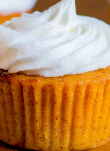 Delicious Impossible Pumpkin Pie Cupcakes topped with cream cheese frosting.