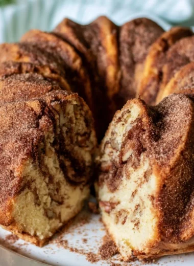 Deliciously moist Cinnamon Coffee Cake topped with a cinnamon crumble.