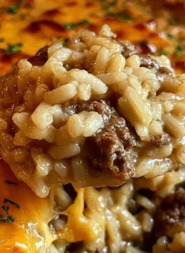 One-pan cheesy ground beef rice casserole topped with melted cheese