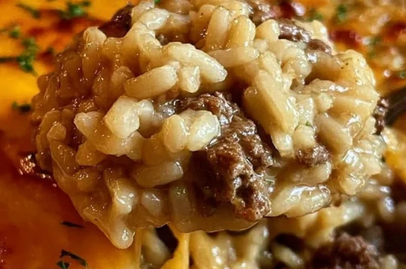 One-pan cheesy ground beef rice casserole topped with melted cheese