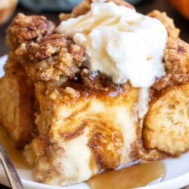Pumpkin French Toast Casserole baked with spices and served in a cozy dish