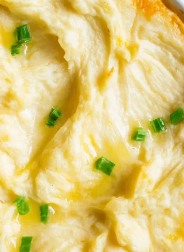Delicious homemade Shepherd's Pie served in a bowl with a golden crust.